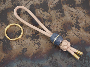 Handmade Diamond Knot Paracord Lanyard Keyring with Barrel Bead (14mm dia. x 15mm) and split ring - Beige Paracord with Blue Denim Micarta & Brass Bead