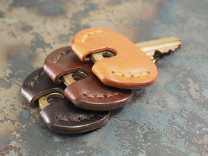 
            
                Load image into Gallery viewer, Handcrafted Leather Door Key Covers - SET OF 3 - Cognac Tan / Chestnut Brown / Dark Brown
            
        